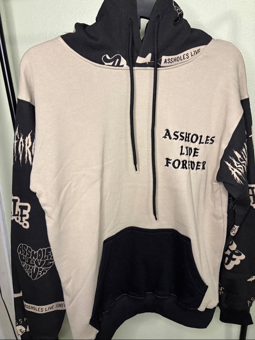 Two-Tone Beige and Black Crewneck Sweatshirt with Graphic Text